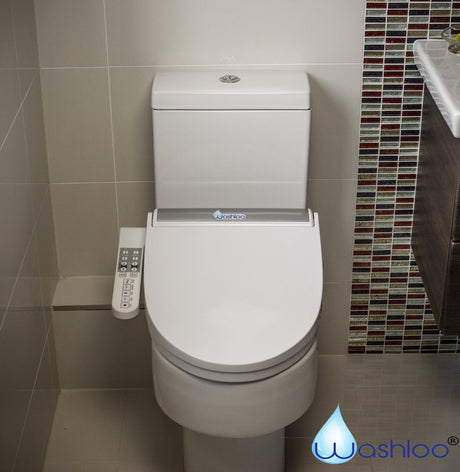 A Washloo smart bidet toilet seat fitted to a standard white toilet pan, with a remote control and T-piece water connector visible