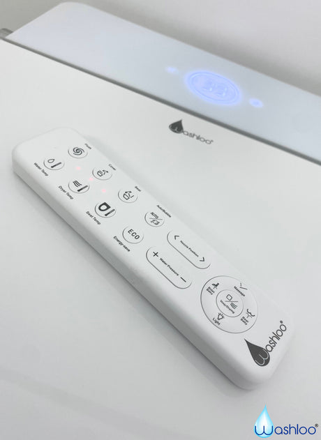 A Washloo smart toilet wireless remote control with the control buttons clearly visible