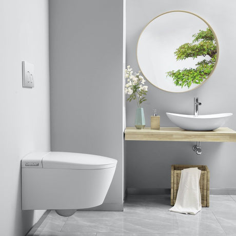 A bright, high-end bungalow en-suite bathroom showcasing an elegant, space-saving smart toilet combination with modern stone tiling.