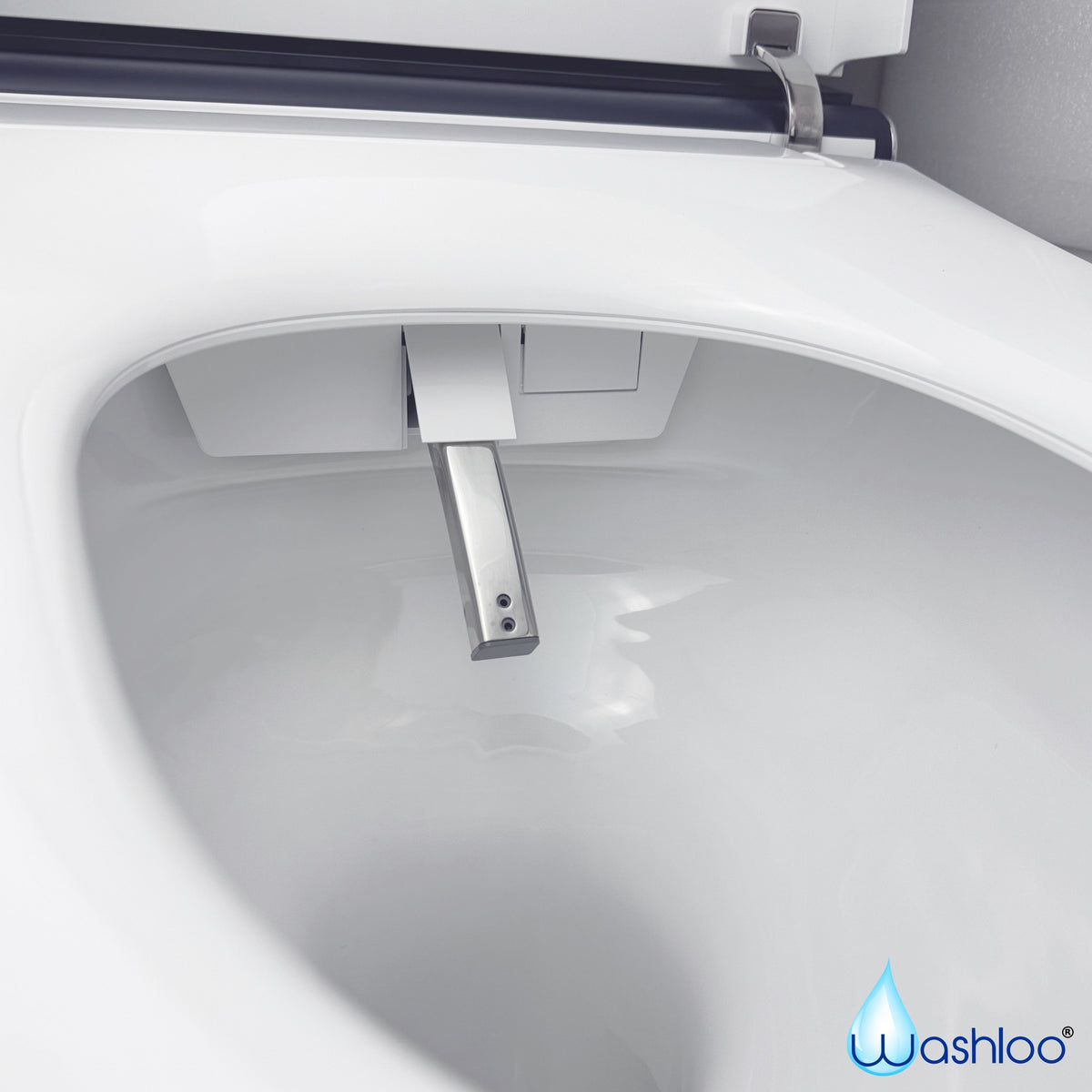 A studio product photograph of a Washloo smart toilet seat and bowl featuring its extended stainless steel self-cleaning nozzle spray against a clean white background.