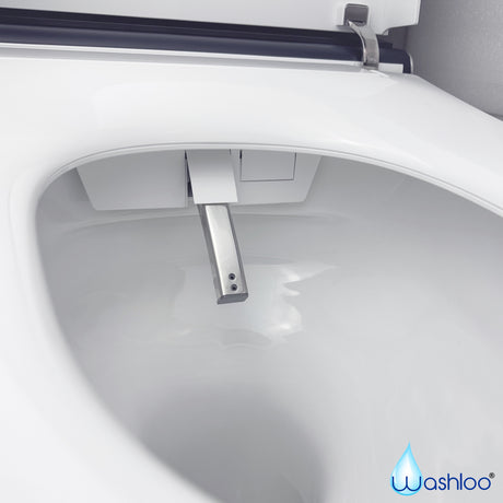 A studio product photograph of a Washloo smart toilet seat and bowl featuring its extended stainless steel self-cleaning nozzle spray against a clean white background.